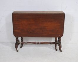 A Victorian mahogany Sutherland table, with turned supports