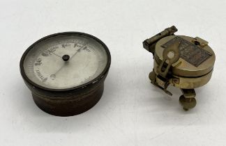 A Stanley brass compass on tripod base along with an antique barometer