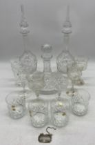 A pair of decanters, a ships decanter, a set of 6 crystal wine glass etc.