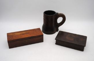 A leather drinking jack, along with two wooden boxes