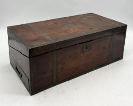 A large antique brass bound writing slope with secret drawer, inkwells and blue velvet interior