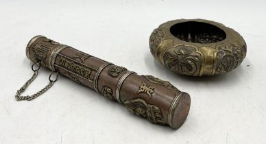 A Chinese brass and copper scroll holder decorated with Buddha, temple dogs and character marks