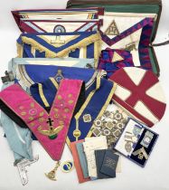A collection of Masonic regalia comprising of aprons, sashes, Rose Croix, handbooks and jewels (some