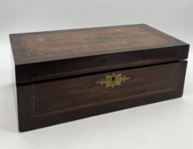 A Victorian writing slope with inlaid brass detail