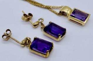 A 9ct gold and amethyst pendant on chain with matching earrings