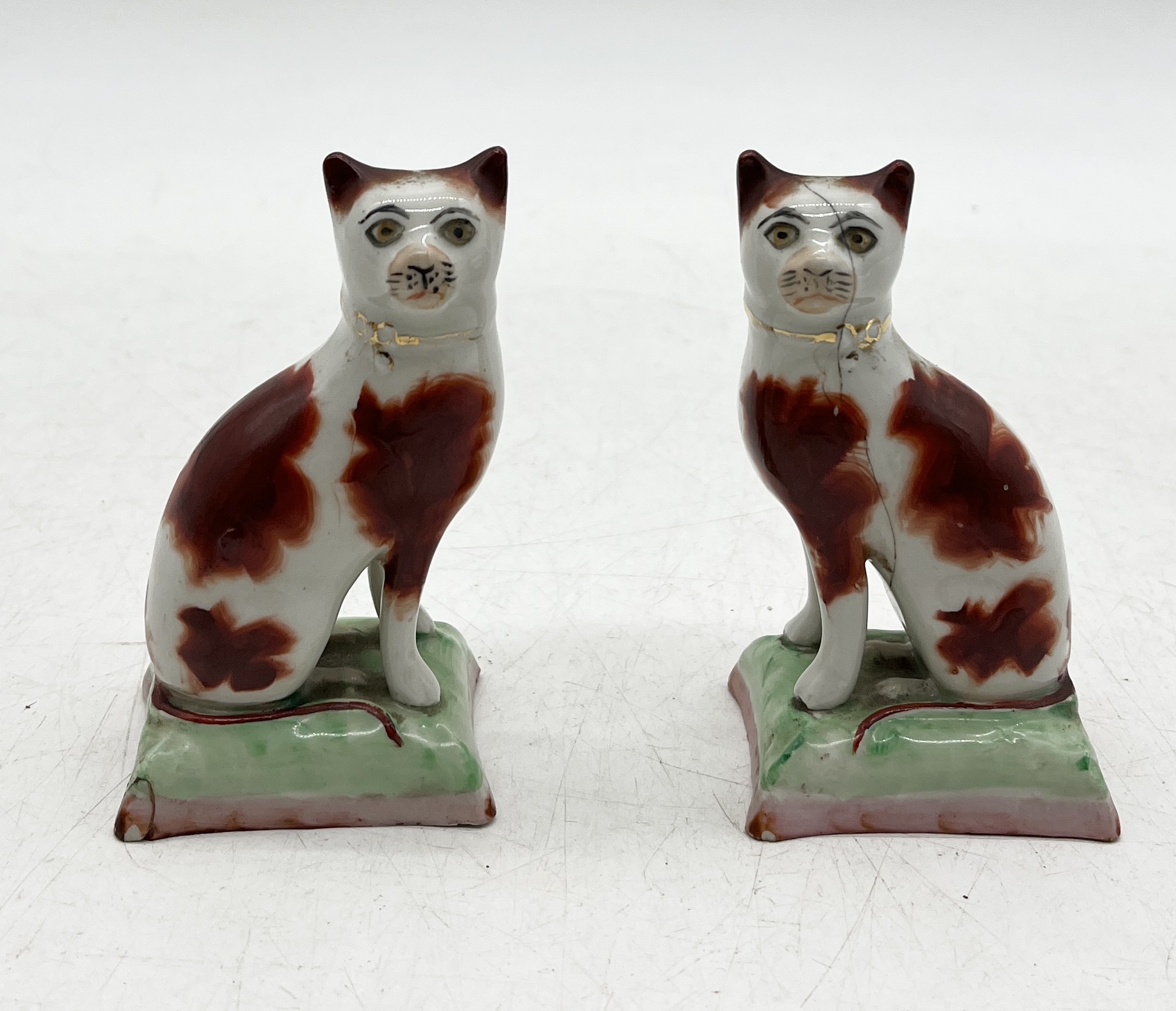 A small Staffordshire figure of a cow along with a pair of Staffordshire cats (1 A/F) - Image 2 of 5