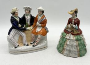 A Staffordshire "Auld Lang Syne" figure group along with a Staffordshire lidded jar in the form of a