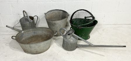 A collection of various galvanised items including watering cans, bucket, baths etc.