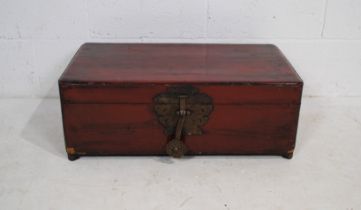 A small Chinese lacquered wooden trunk - length 71cm, depth 40cm, height 26cm