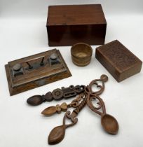 A collection of various items including felt lined wooden box, inkwell stand, love spoons etc.