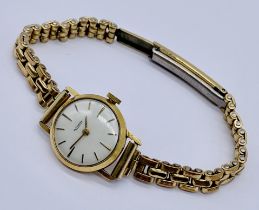 A ladies 9ct gold Rotary wristwatch on rolled gold strap