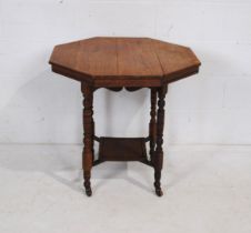 A turn of the century mahogany octagonal table, with turned legs - length 74.5cm, depth 75cm, height