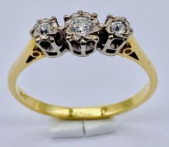 A diamond three stone ring set in 18ct gold, size T