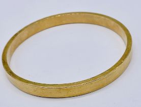 A 15ct gold "slave" bangle, weight 14.8g