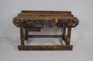 An industrial wooden workbench, with a 'Parkinsons' Perfect Vise' and single drawer - length