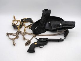 A Sussex Armoury Single Action Army Colt 45 replica, with black leather holster and bandolier, along