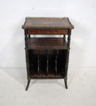 A turn of the century inlaid music cabinet, with adjustable tilting top with brass gallery tray