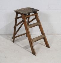 A set of rustic wooden folding steps