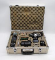 A vintage Olympus OM-10 camera, with four lenses - a Sigma Mini-Wide II 1:28 Macro lens, Olympus