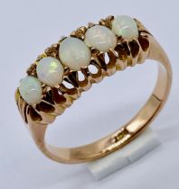 An opal five stone ring set in 9ct gold, size O 1/2