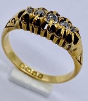 An 18ct gold diamond five stone "boat " ring, size L