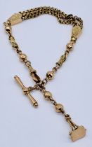 A Victorian 9ct gold fancy bracelet with a fob seal , total weight 14.3g