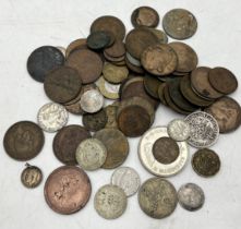 A collection of various coinage including a small amount of silver