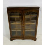 A 'Cameo Furniture' wooden display cabinet, raised on bracket feet - length 88cm, depth 30cm, height