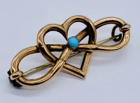 A 9ct gold heart shaped brooch set with turquoise, weight 2.5g