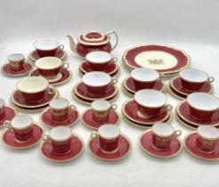 A Spode Copelands china tea and coffee set (one saucer missing), decorated with the cloth workers