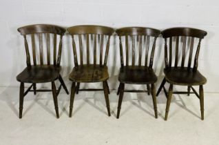 A set of four stained beech farmhouse chairs