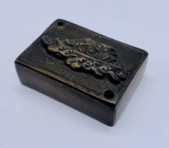 A Chinese bronze water dropper of rectangular form