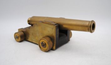 A model brass cannon - barrel length 26cm