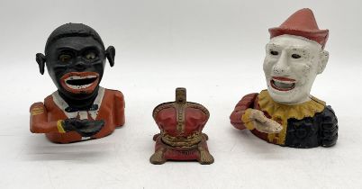 A collection of cast iron money boxes including 1953 Coronation crown and two others in the form