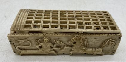 A Napoleonic prisoner of war part set of "double 9" bone dominoes (49) in carved casket decorated