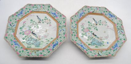 A pair of vintage Japanese porcelain plates, with traditional designs and character signatures -