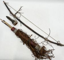 An African bow, quiver and arrows with numerous tassels and woven leather detail