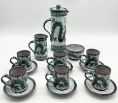 A Tintagel Pottery coffee set with green dragon decoration