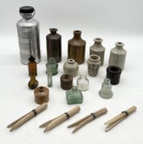 A collection of stoneware jars, antique glass bottles, wooden pegs etc.