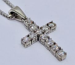 A 9ct white gold cross set with diamonds on a matching chain, total weight 4.5g