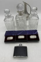 A hallmarked 925 silver mounted decanter along with a smaller pair of decanters, Selangor pewter