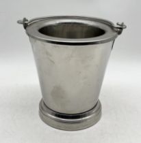 A vintage ice bucket stamped "Freud" to either side