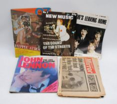 A collection of newspaper cuttings and articles relating to John Lennon's death, along with other