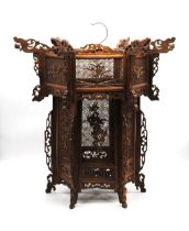 A Chinese wooden fretwork lantern, decorated with carved dragons - length 63cm, height 64.5cm