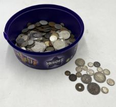 A collection of various coinage including a small amount of silver