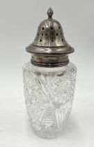 A hallmarked silver and cut glass sugar shaker