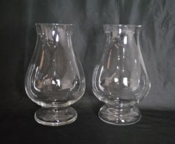 A pair of glass vases of bulbous form - height 29cm
