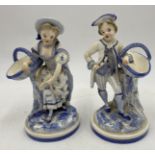 A pair of antique Royal Worcester blue and white porcelain figures modelled as a gallant and his