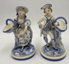 A pair of antique Royal Worcester blue and white porcelain figures modelled as a gallant and his