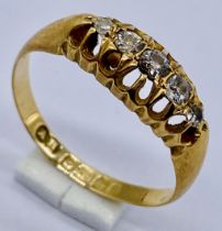 An 18ct gold diamond 5 stone ring, size M 1/2